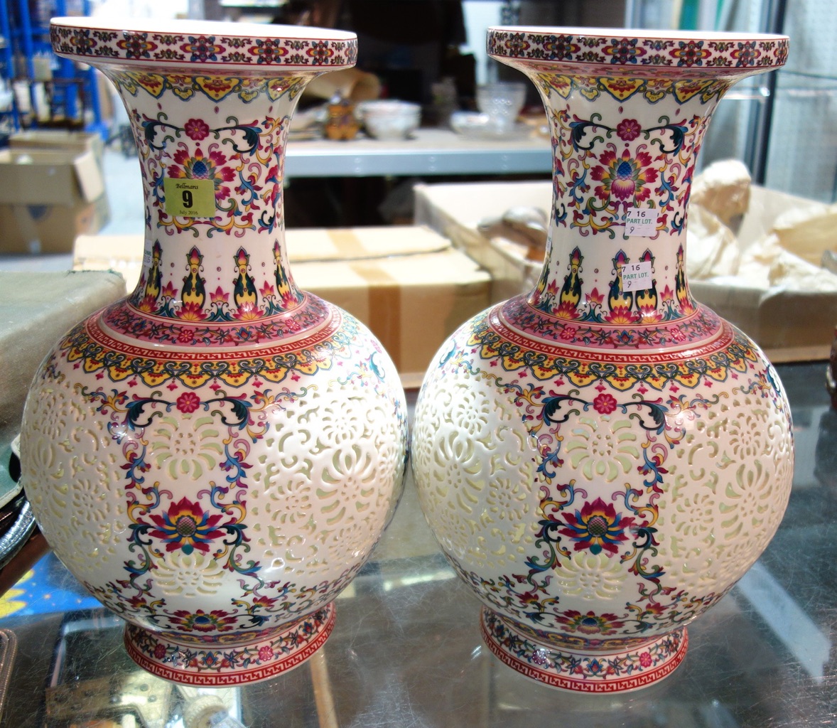 A pair of large 20th century Oriental ceramic vases with pierced decoration. (2)