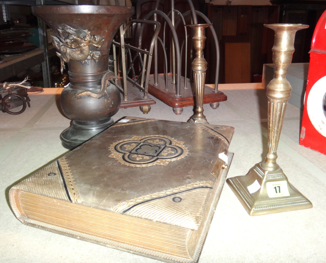A pair of 19th century brass candlesticks, a Chinese bronze vase with parcel gilt dragon decoration, and a Victorian photo album. (4)