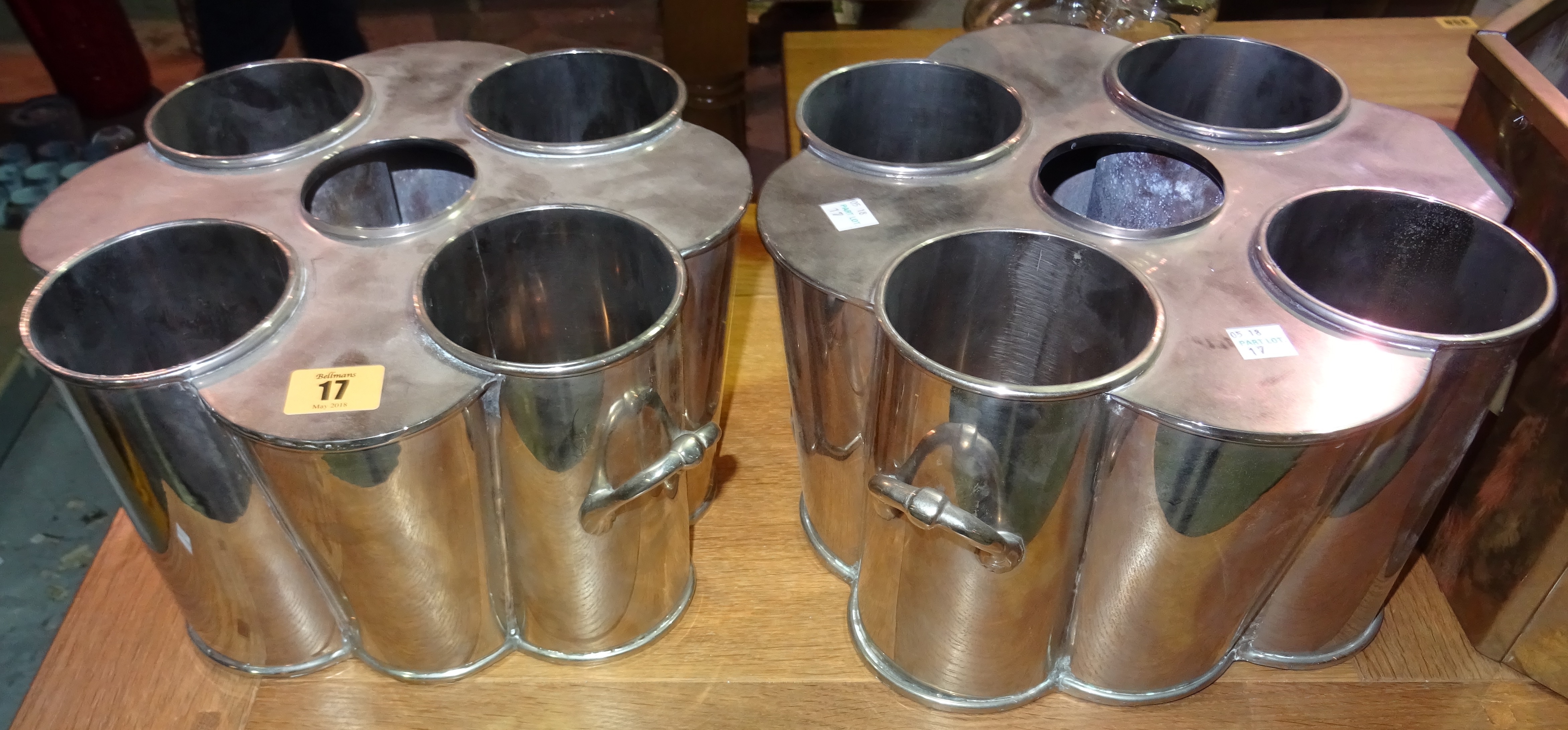 A pair of 20th century silver plated four bottle wine coolers, (2).  H2