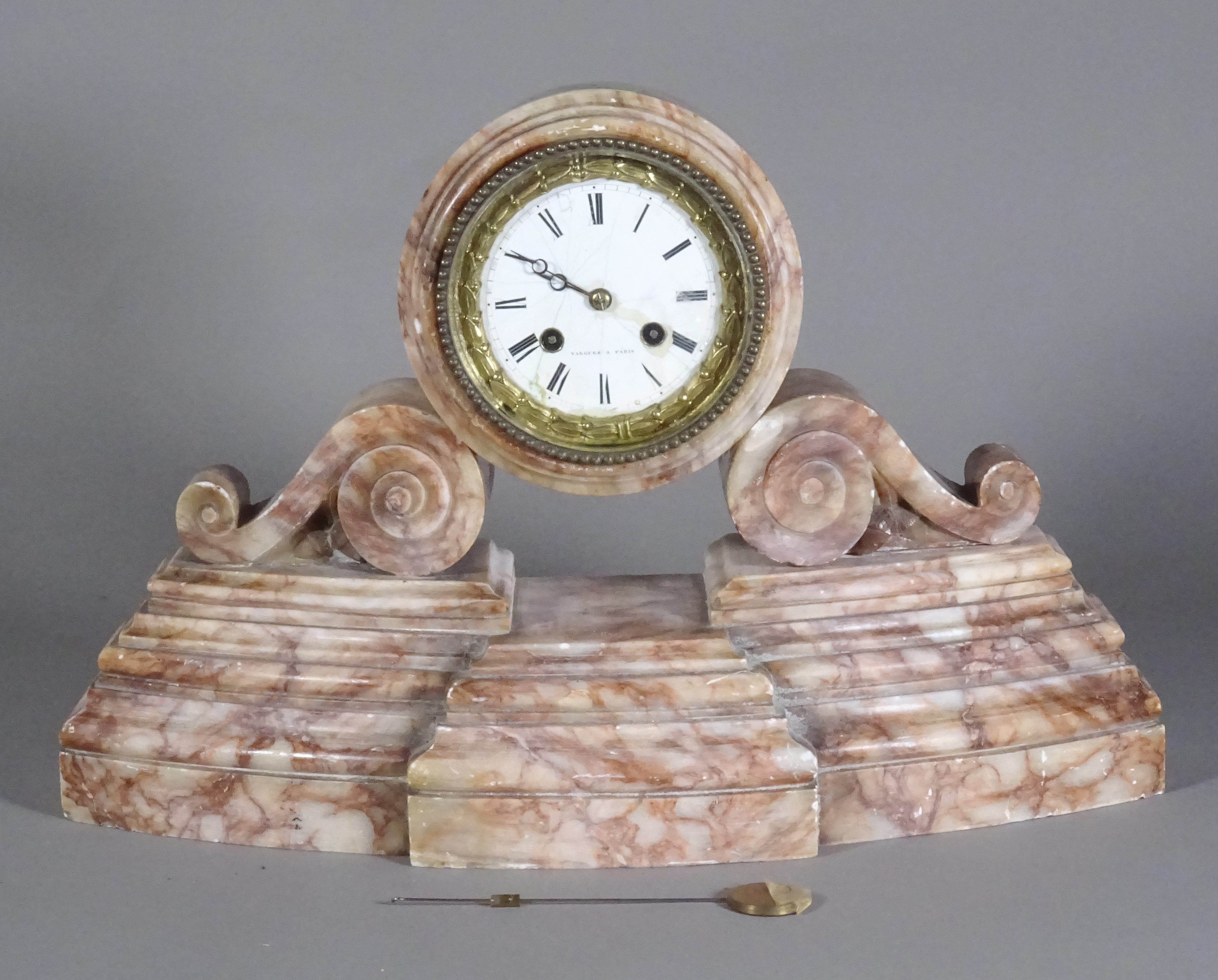 An early 20th century rose marble French mantel clock. 40cm wide, 29cm tall.  S2T
