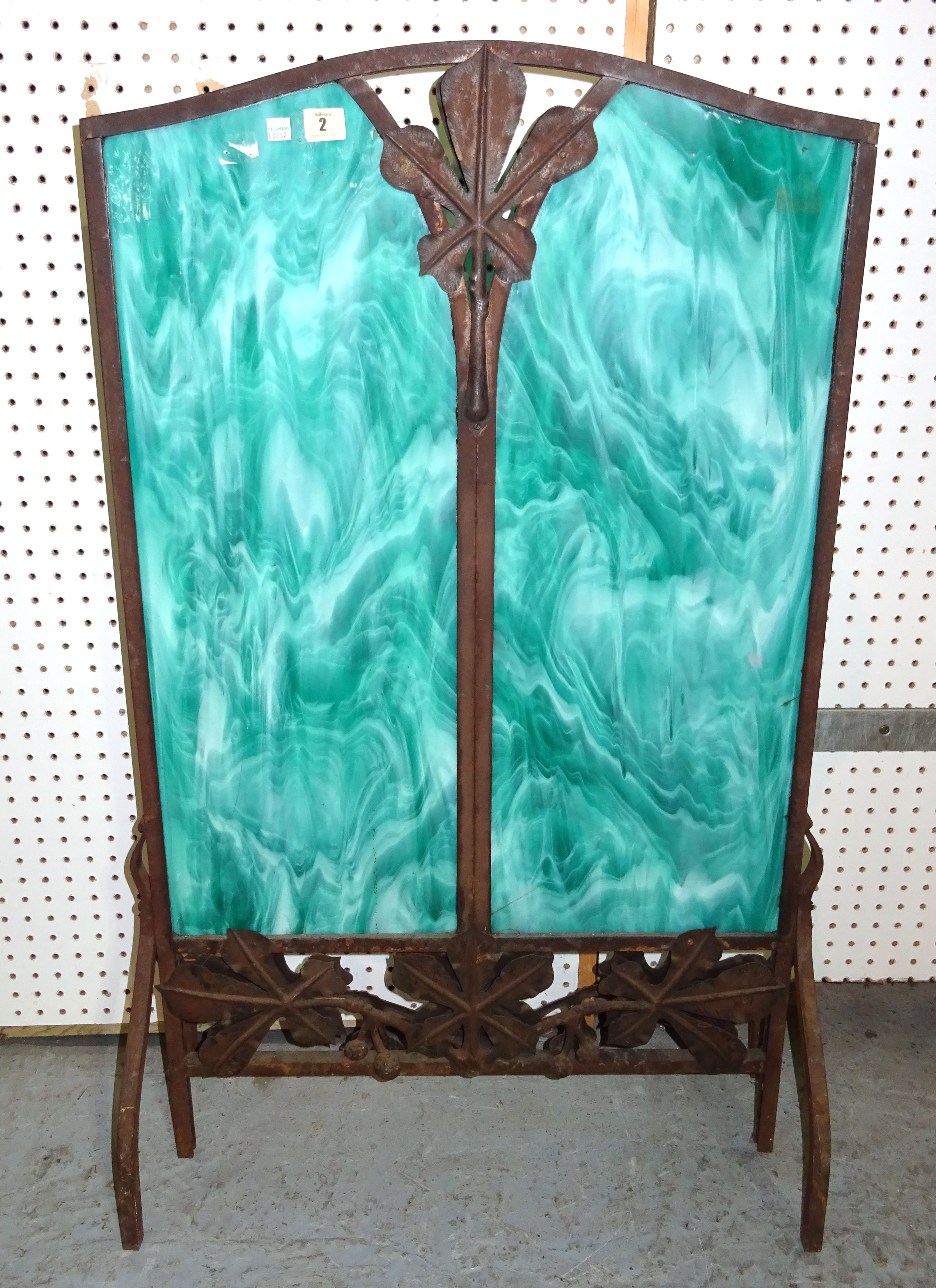A French Art Nouveau wrought iron fire screen with inset faux hardstone panels of foliate rectangular form on shaped supports, 106cm high.  BAY 1
