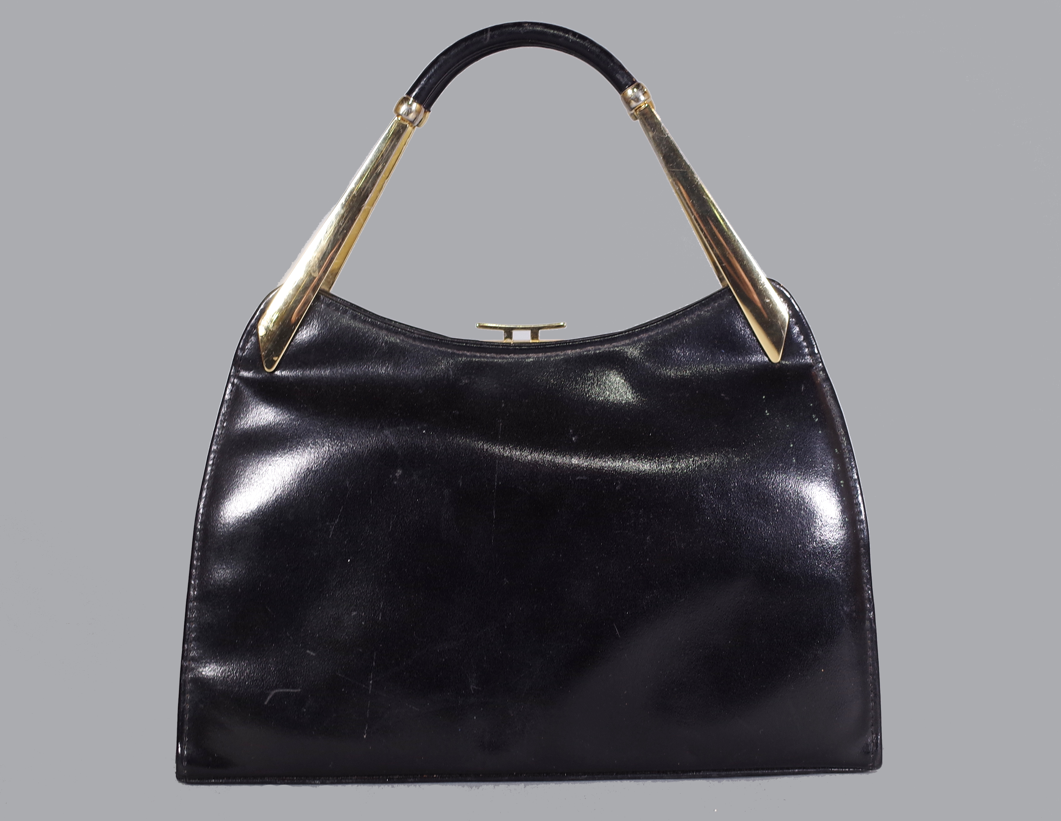 Elbief for Ackery London; a gold colour metal framed leather handbag, stamped and labelled, 29.5cm high.