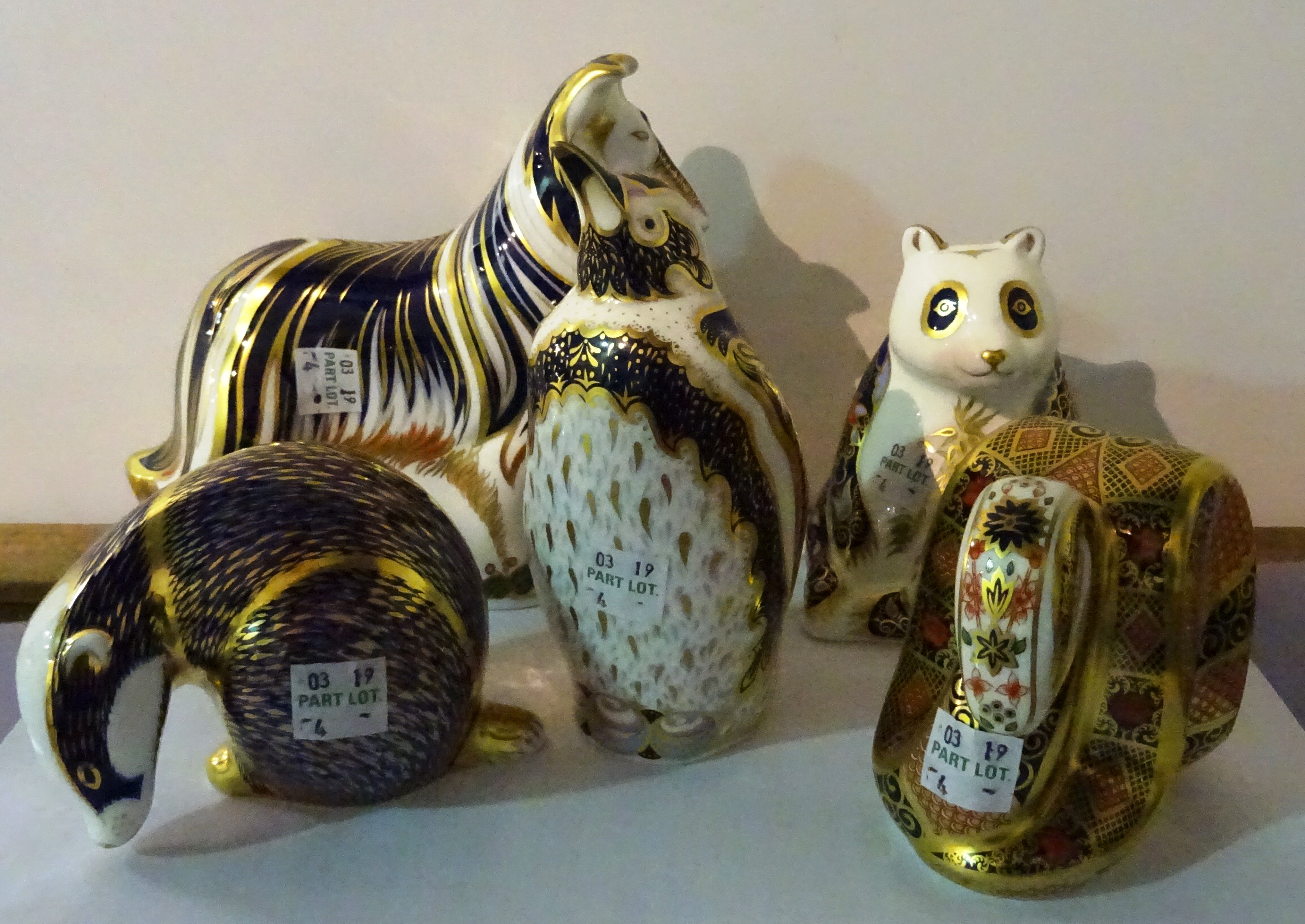 Five Royal Crown Derby Imari paperweights of animals comprising a rough collie, a panda, a snake, a badger and a penguin, (5).
