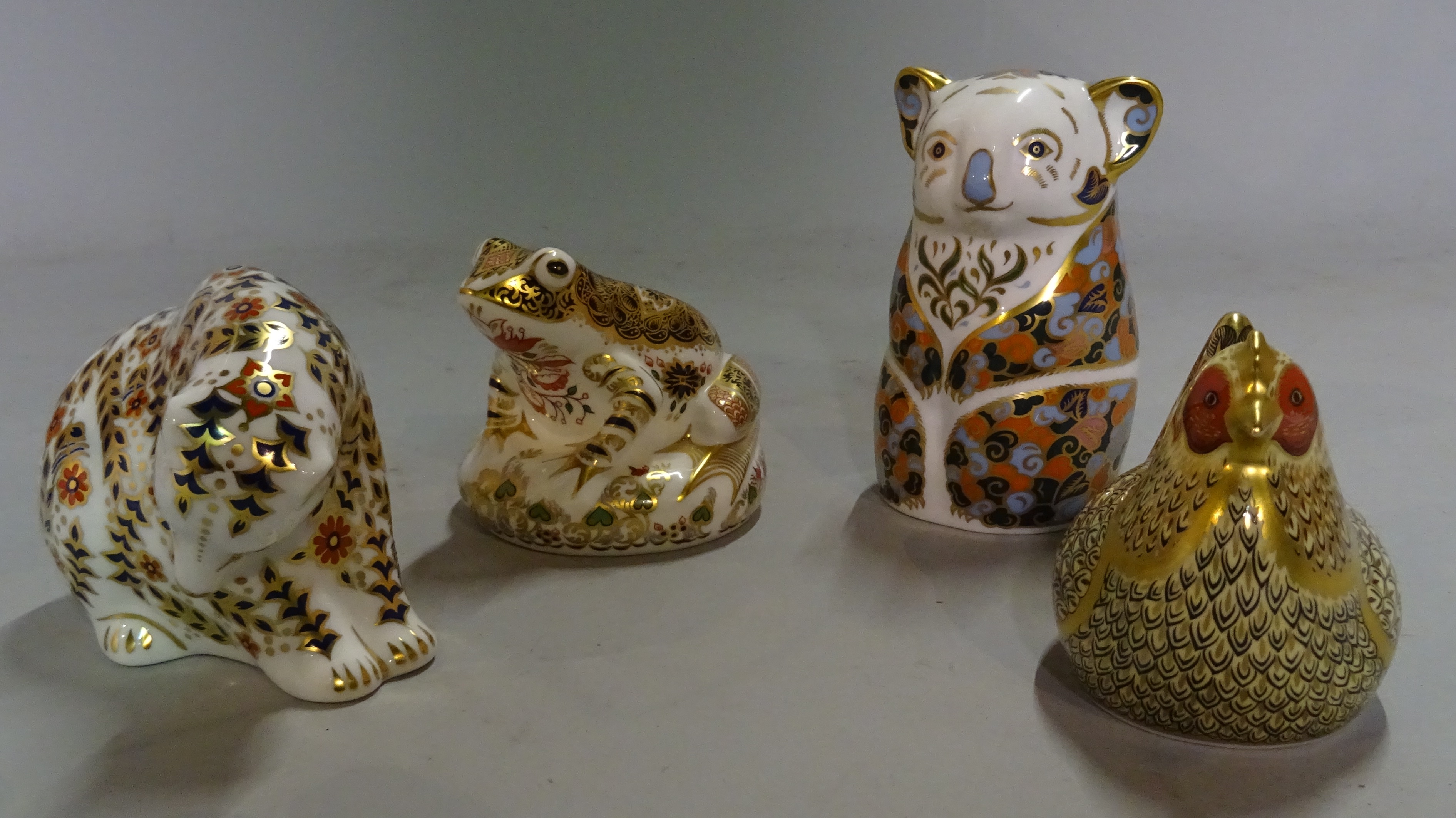 Four Royal Crown Derby Imari paperweights modelled as animals, comprising; a chicken, a koala, a bear and a frog.