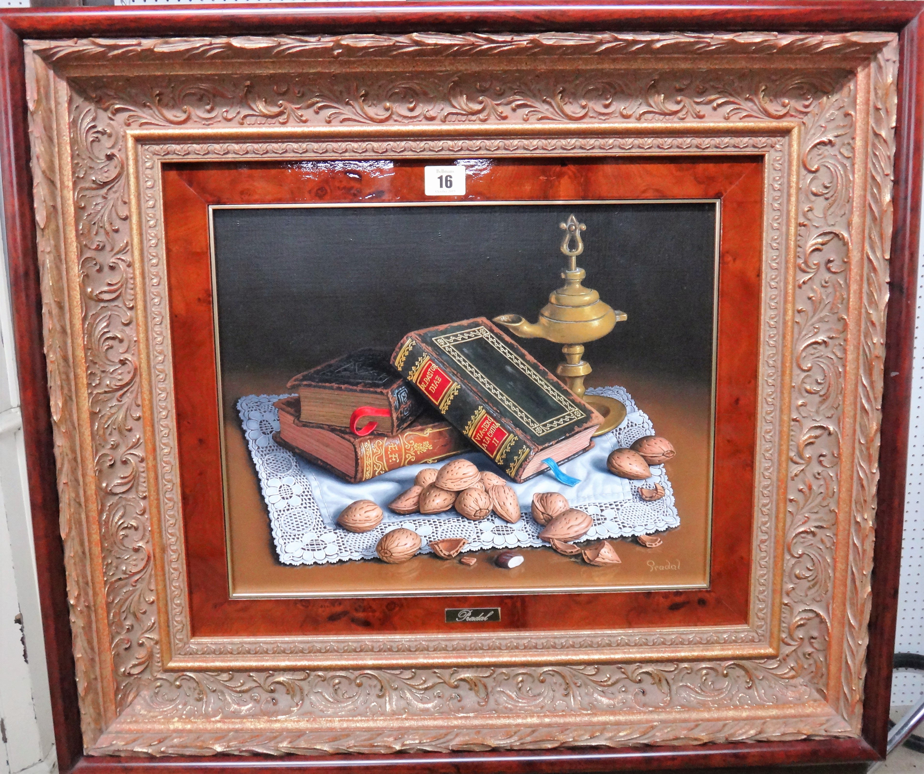** Pradal (20th century), Still life of books, oil lamp and walnuts, oil on canvas, signed, 31cm x 39cm.