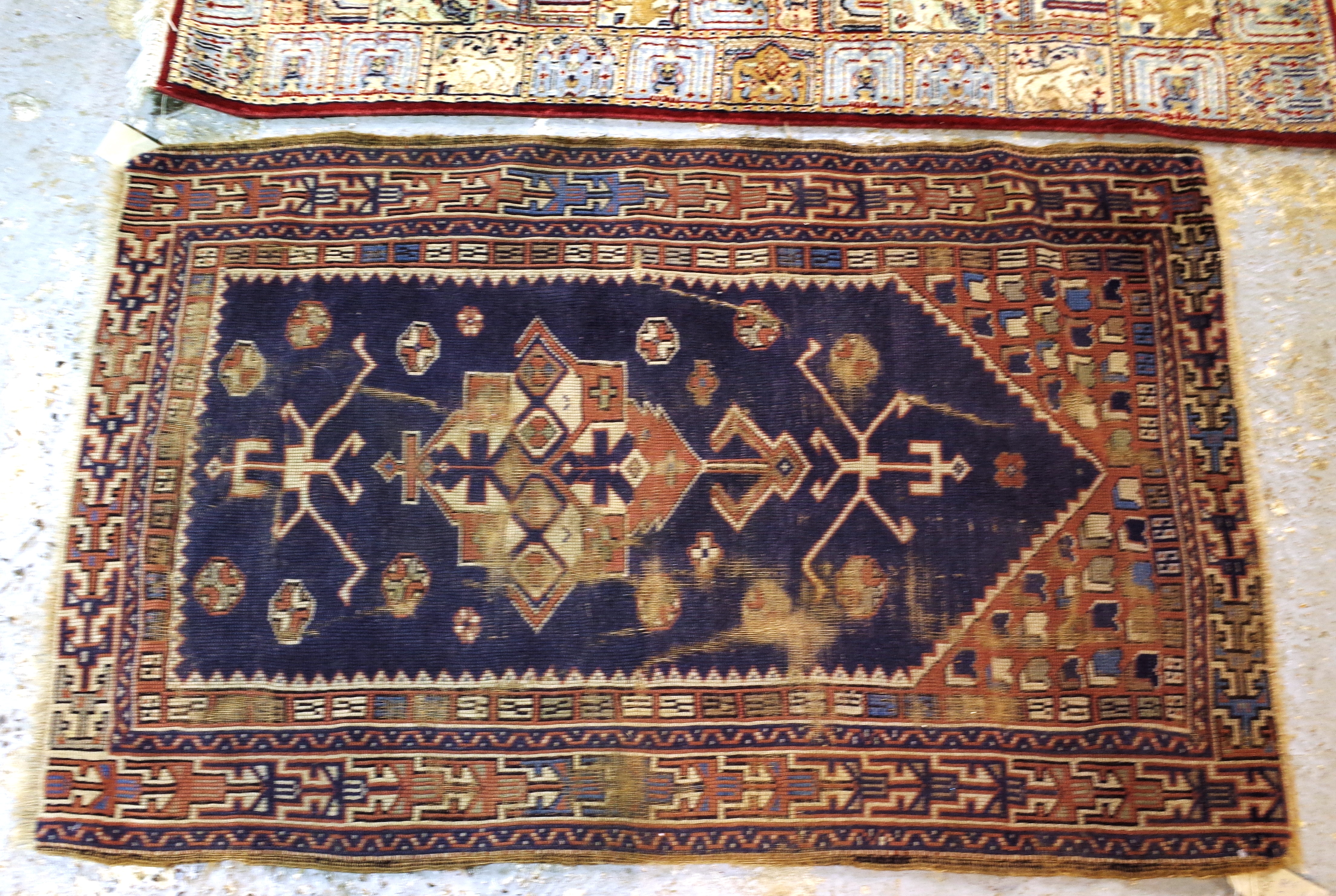 An Indian compartment rug, 162cm x 94cm, and a Turkish prayer rug, 144cm x 92cm, (2).