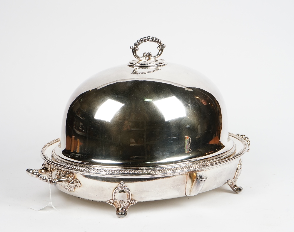 An electroplate oval meat dish cover, with beaded borders, and an oval two handled hot water heater base, on scroll feet headed by cabochons (2).