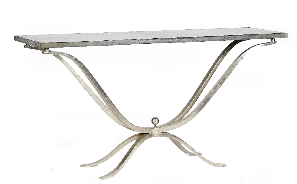 A contemporary console table, the rectangular slate top on a curved silvered wrought metal quadripartite base, 181cm wide x 90cm high.