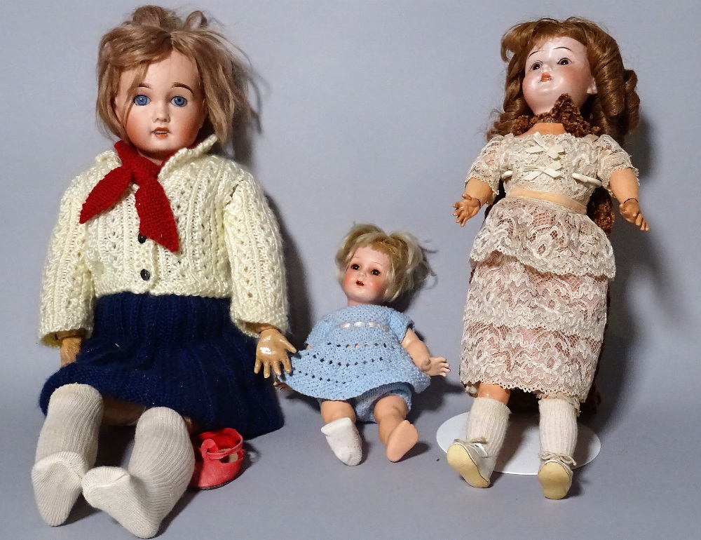 A Simon & Halbig bisque head doll and two further early 20th century bisque head dolls, (3).  S4M