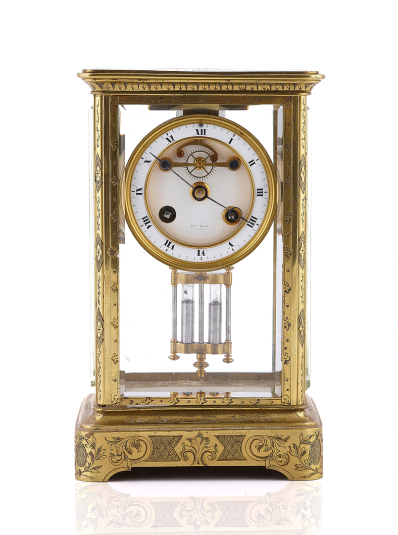 A FRENCH ENGRAVED BRASS FOUR GLASS TABLE REGULATOR CLOCK