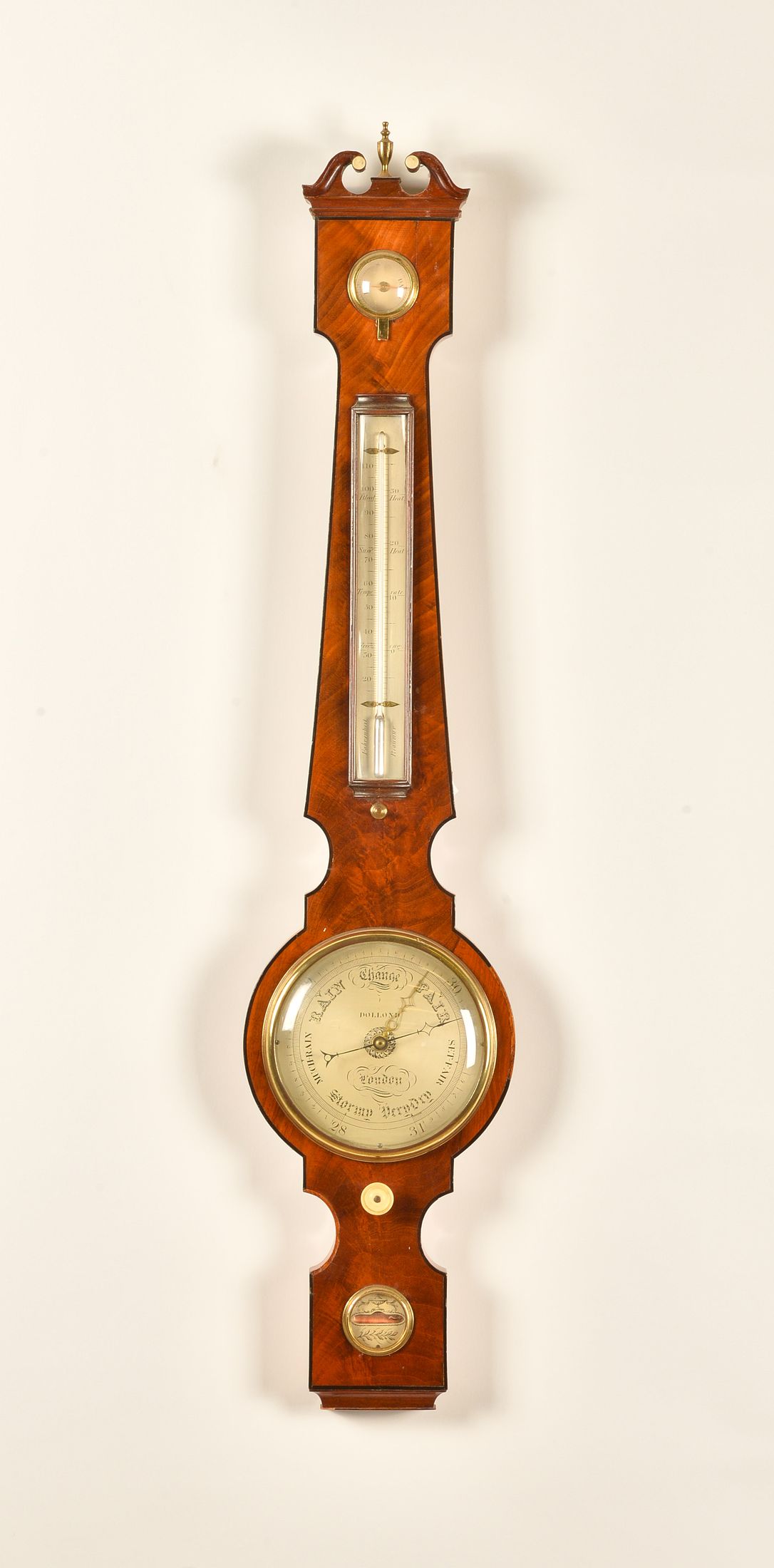 A GEORGE III MAHOGANY AND OUTLINED SMALL BAROMETER