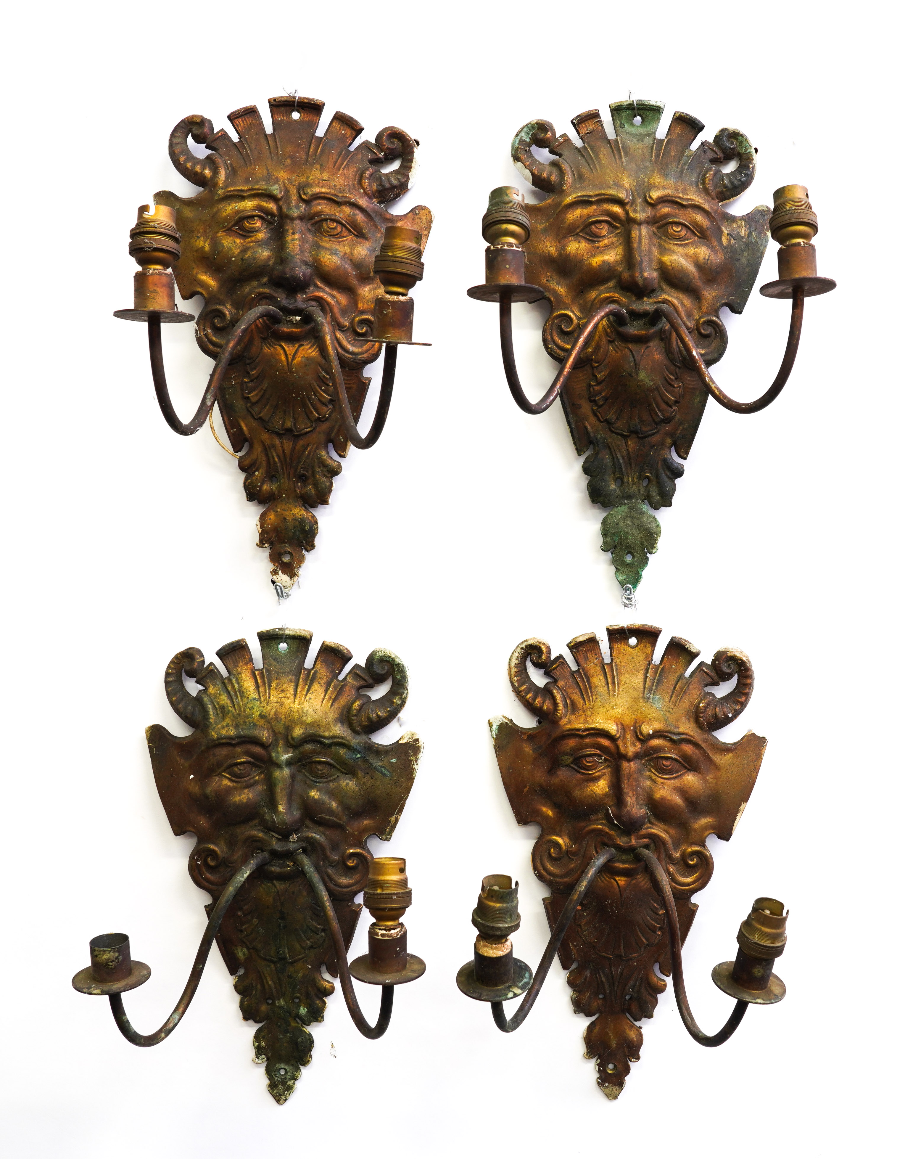 A SET OF FOUR GILT-METAL SATYR MASK TWIN-LIGHT WALL APPLIQUES (4)