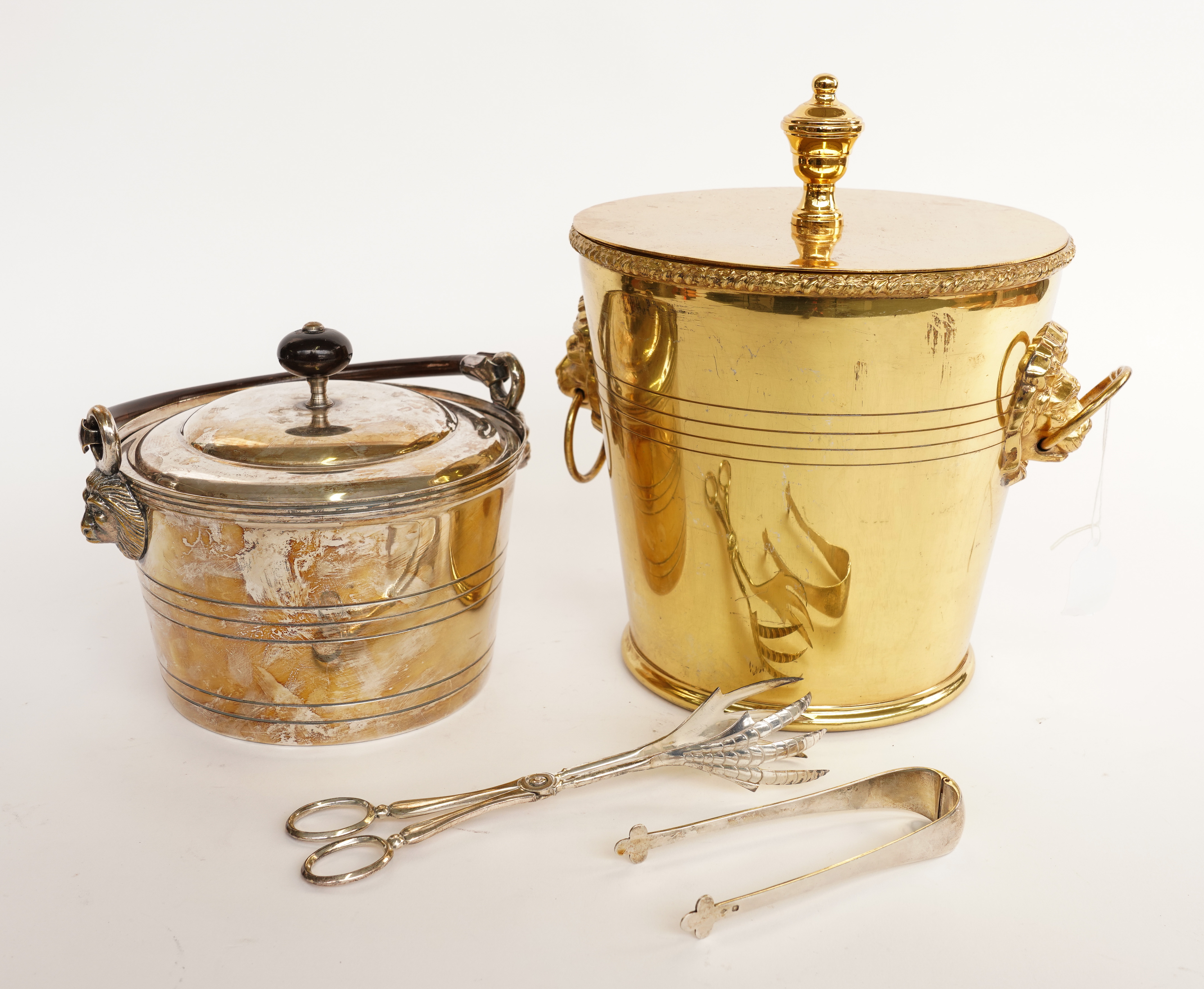 VALENTI: A SPANISH SILVER-PLATED ICE BUCKET AND ANOTHER GILT-METAL ICE BUCKET, WITH FRENCH SILVER ODIOT ICE TONGS  (4)
