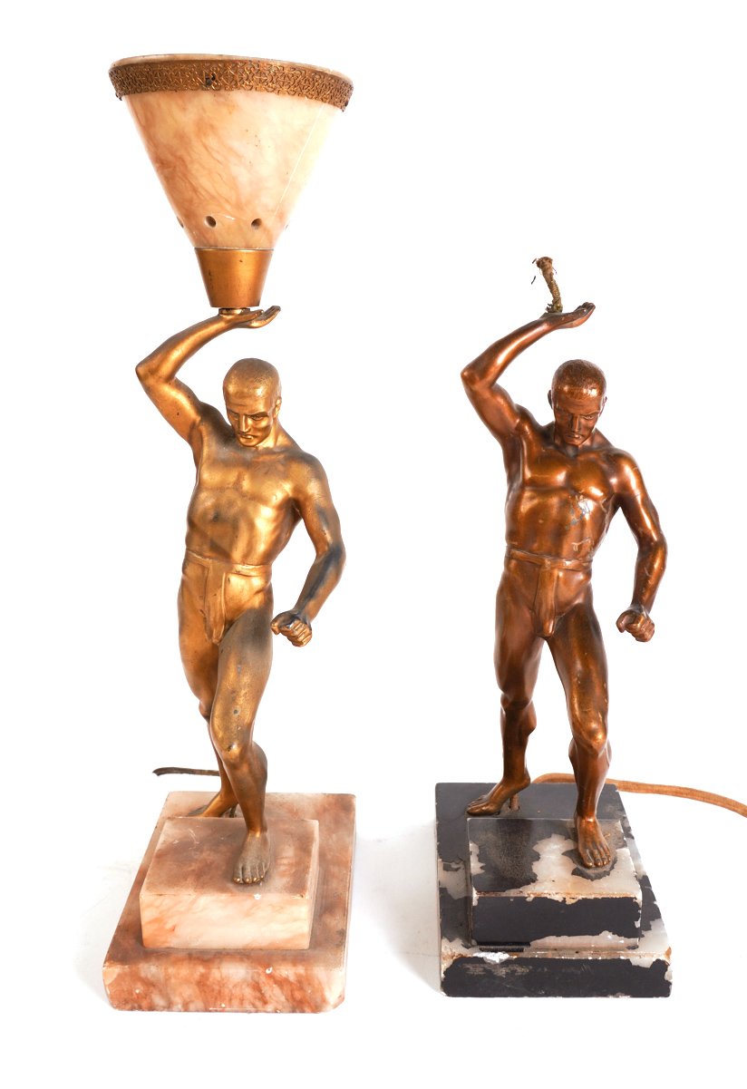 A NEAR PAIR OF ART DECO GILT-METAL FIGURAL TABLE LAMPS MODELLED AS MALE ATHLETES