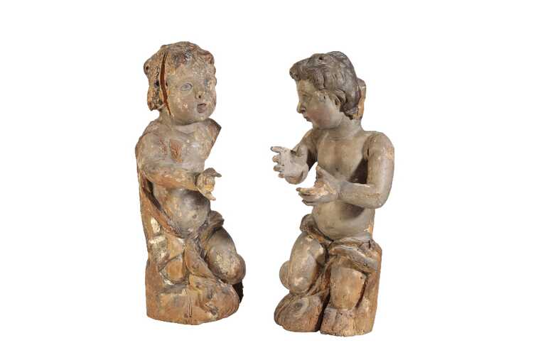 PAIR OF CENTRAL EUROPEAN CARVED AND PAINTED WOOD MODELS OF PUTTI