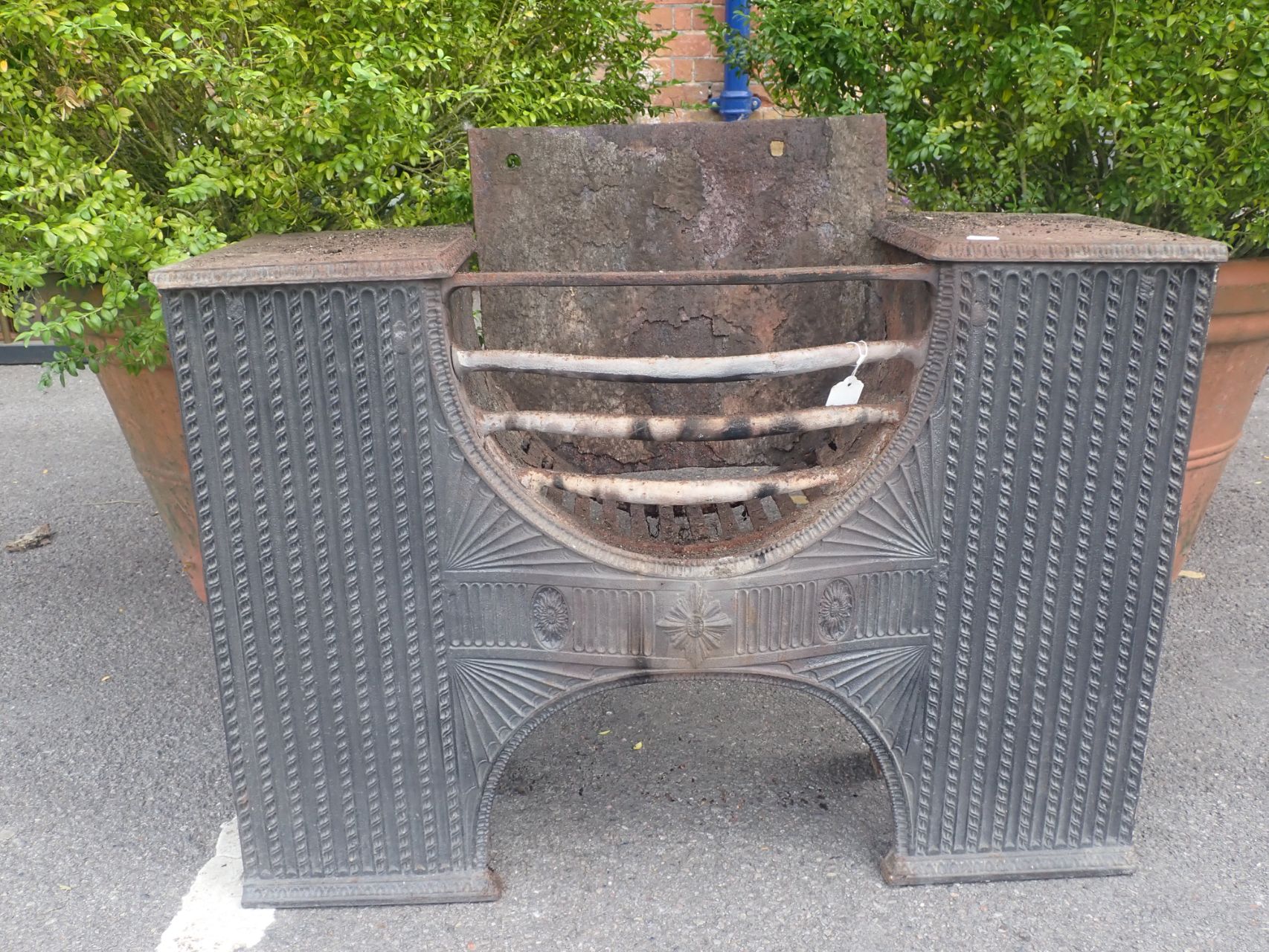 A CAST IRON HOB GRATE, IN THE COALBROOKDALE STYLE