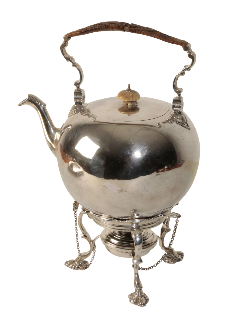 A SILVER TEAPOT ON STAND