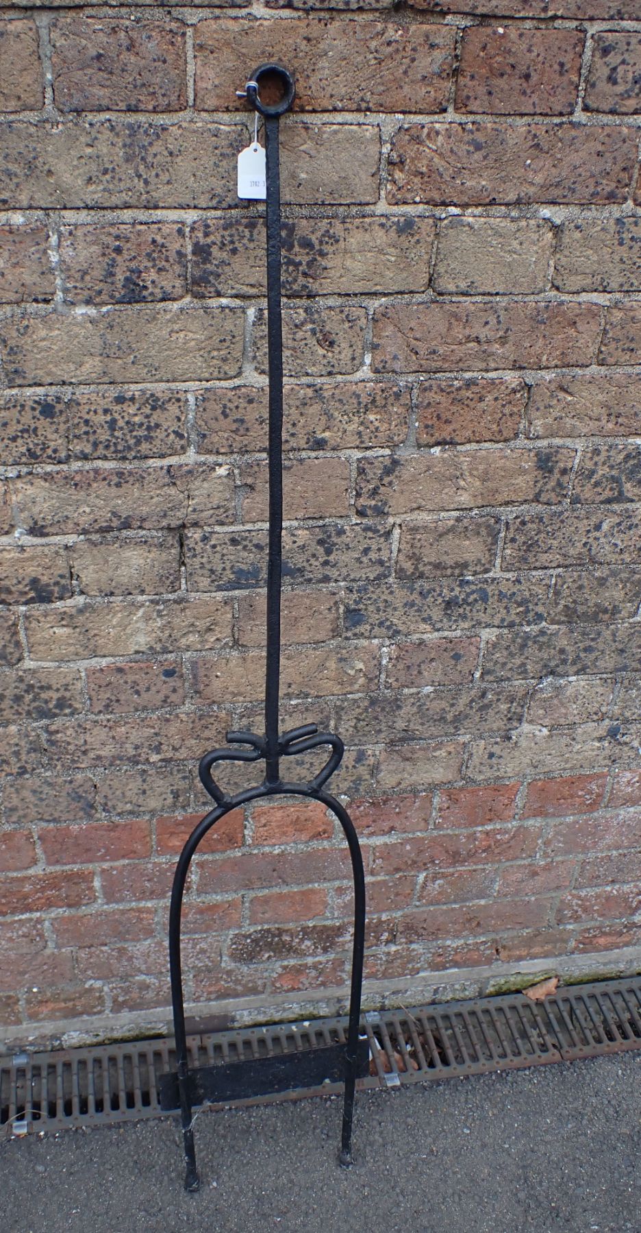 A COUNTRY HOUSE WROUGHT IRON BOOTSCRAPER