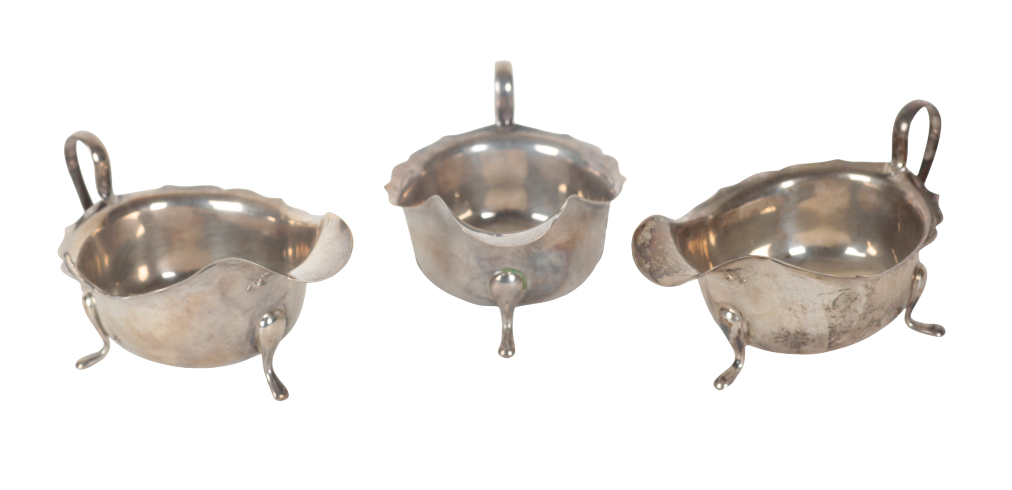 A SET OF THREE MATCHED SILVER SAUCE BOATS