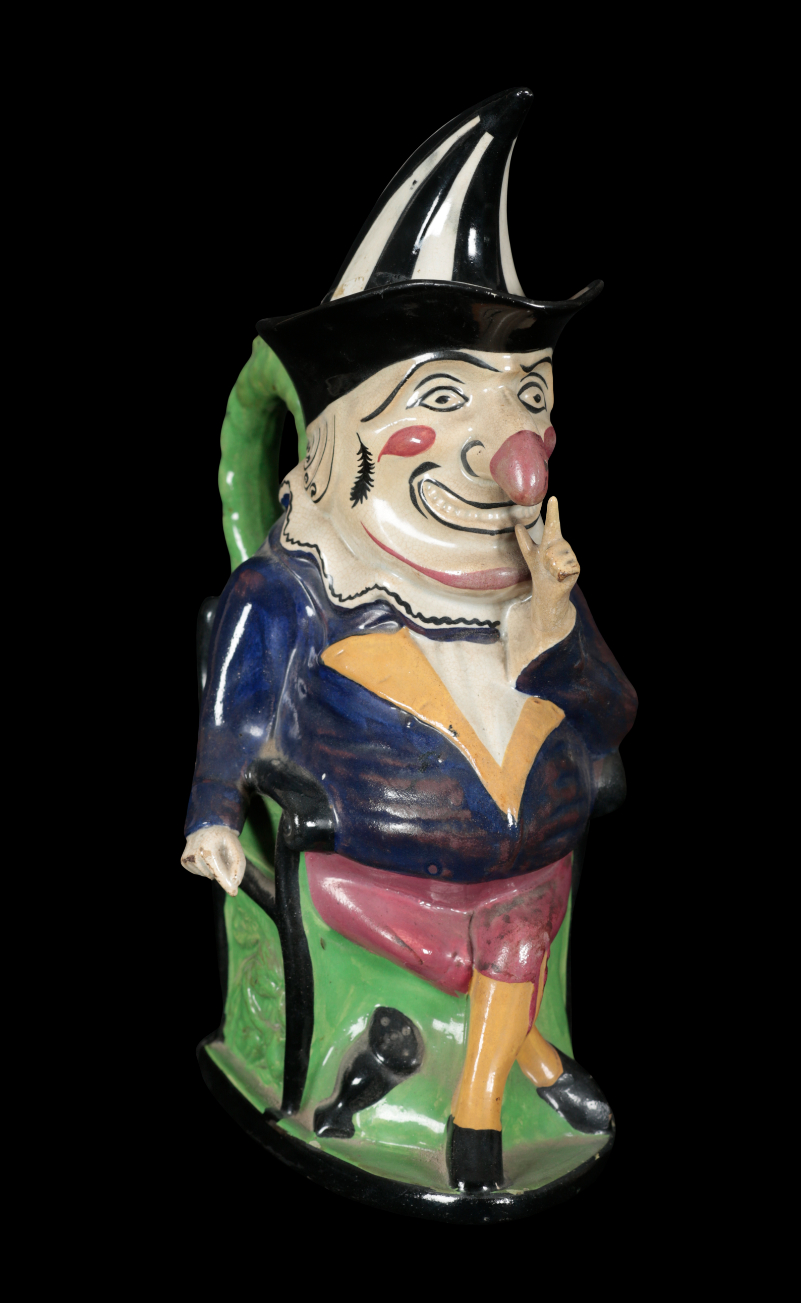 A STAFFORDSHIRE TOBY JUG IN THE FORM OF MR PUNCH