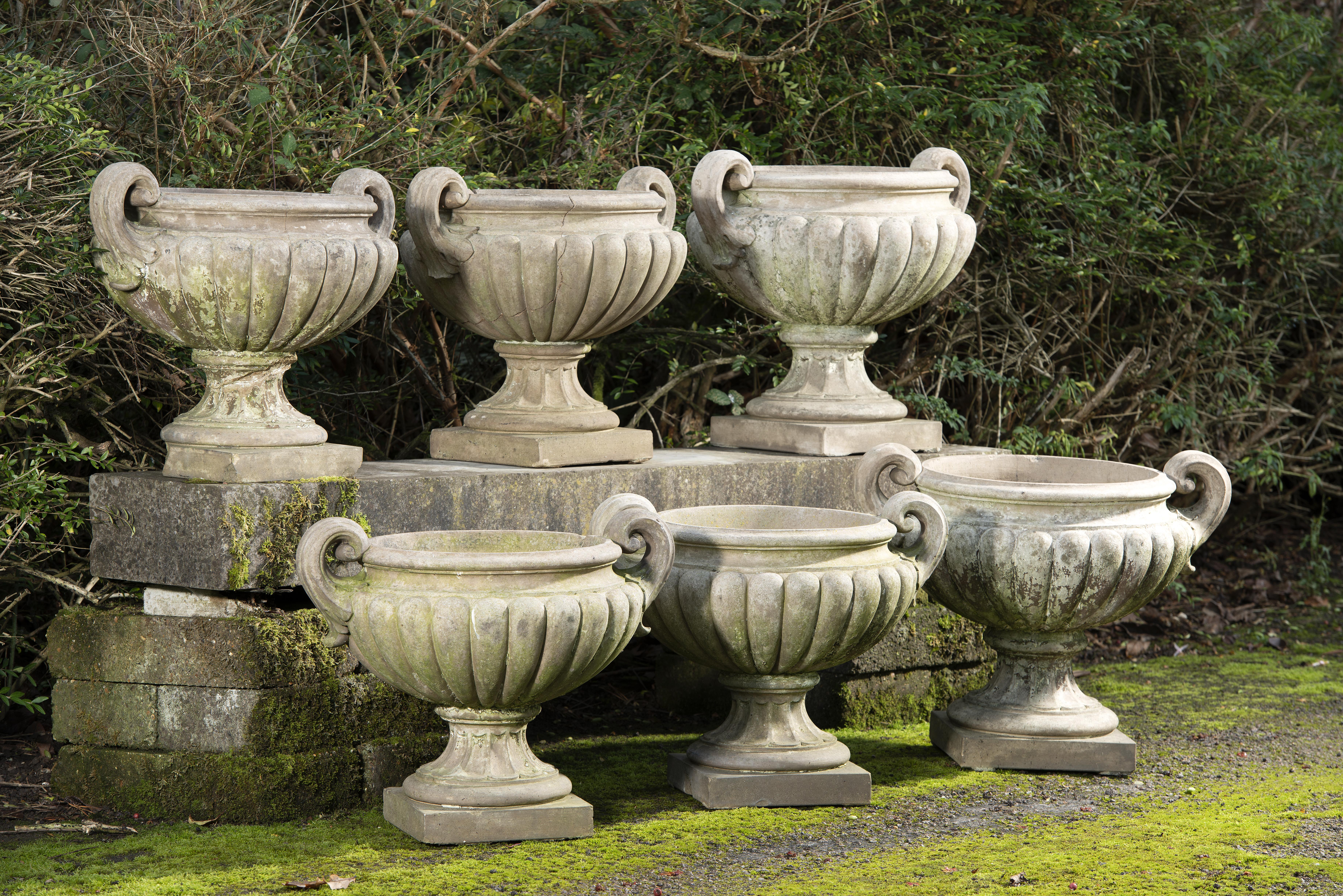 A near set of six Pulham stoneware urns circa 1870 some stamped (one damaged) the largest 51cm high by 60cm wide; the smaller 48cm high by 56cm...