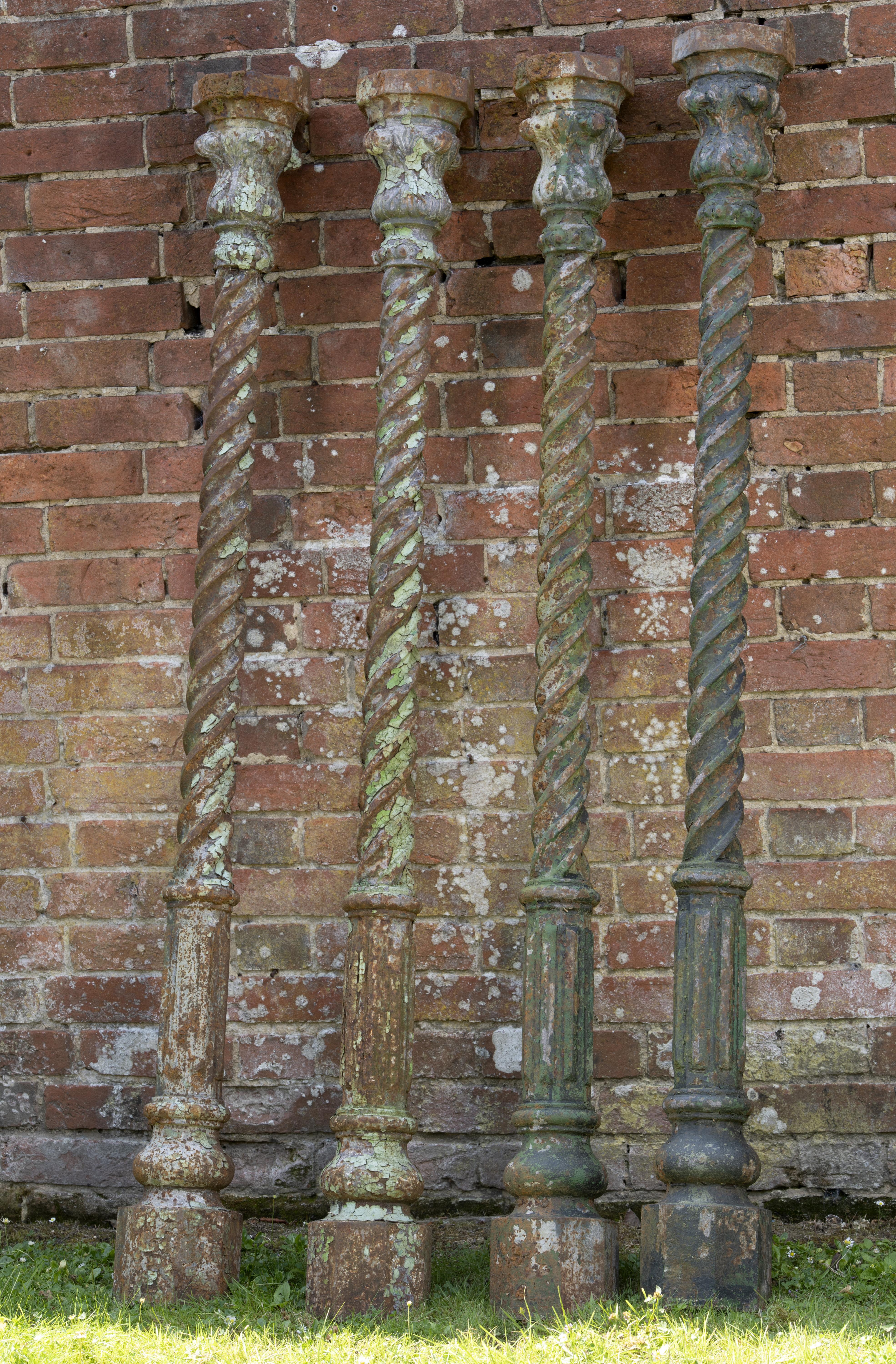 A set of four cast iron uprights  late 19th century  168cm high  
