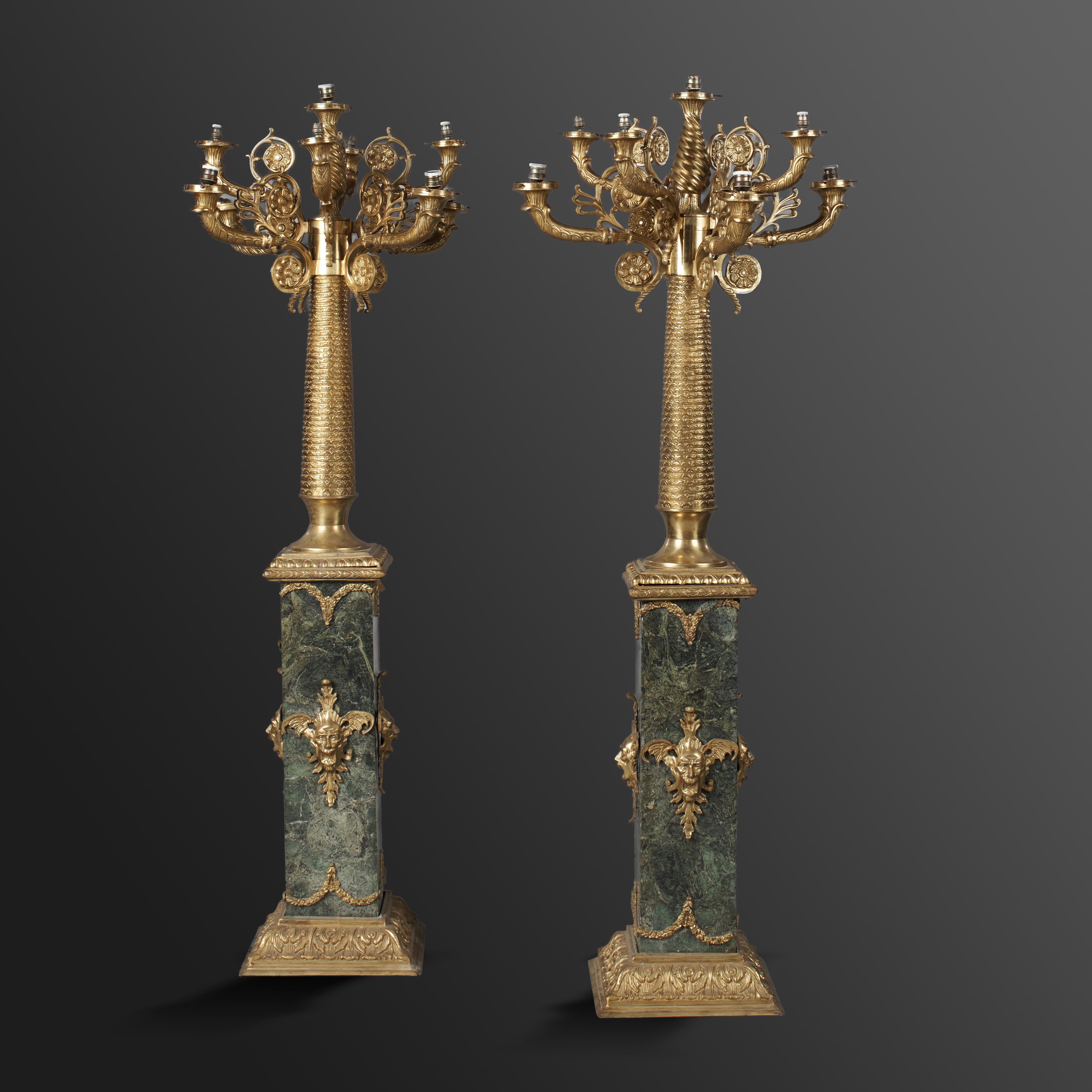 A pair of gilt metal and green veined marble standing candelabra modern 186cm high