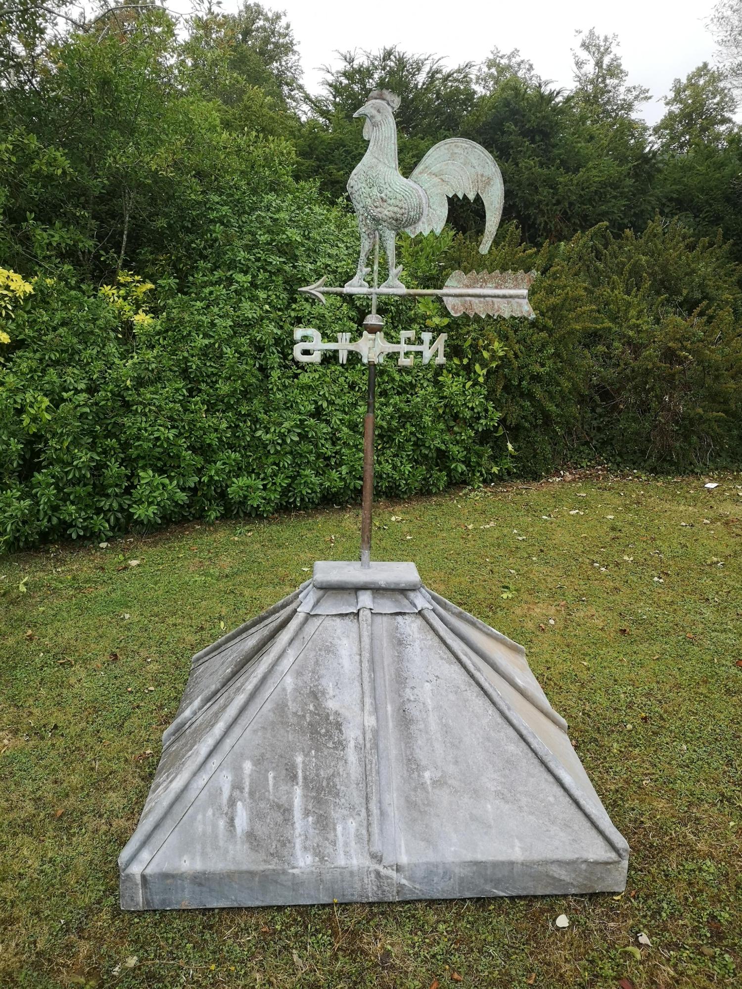 A sheet copper three dimensional weathervane 20th century on earlier lead mounted base 192cm high