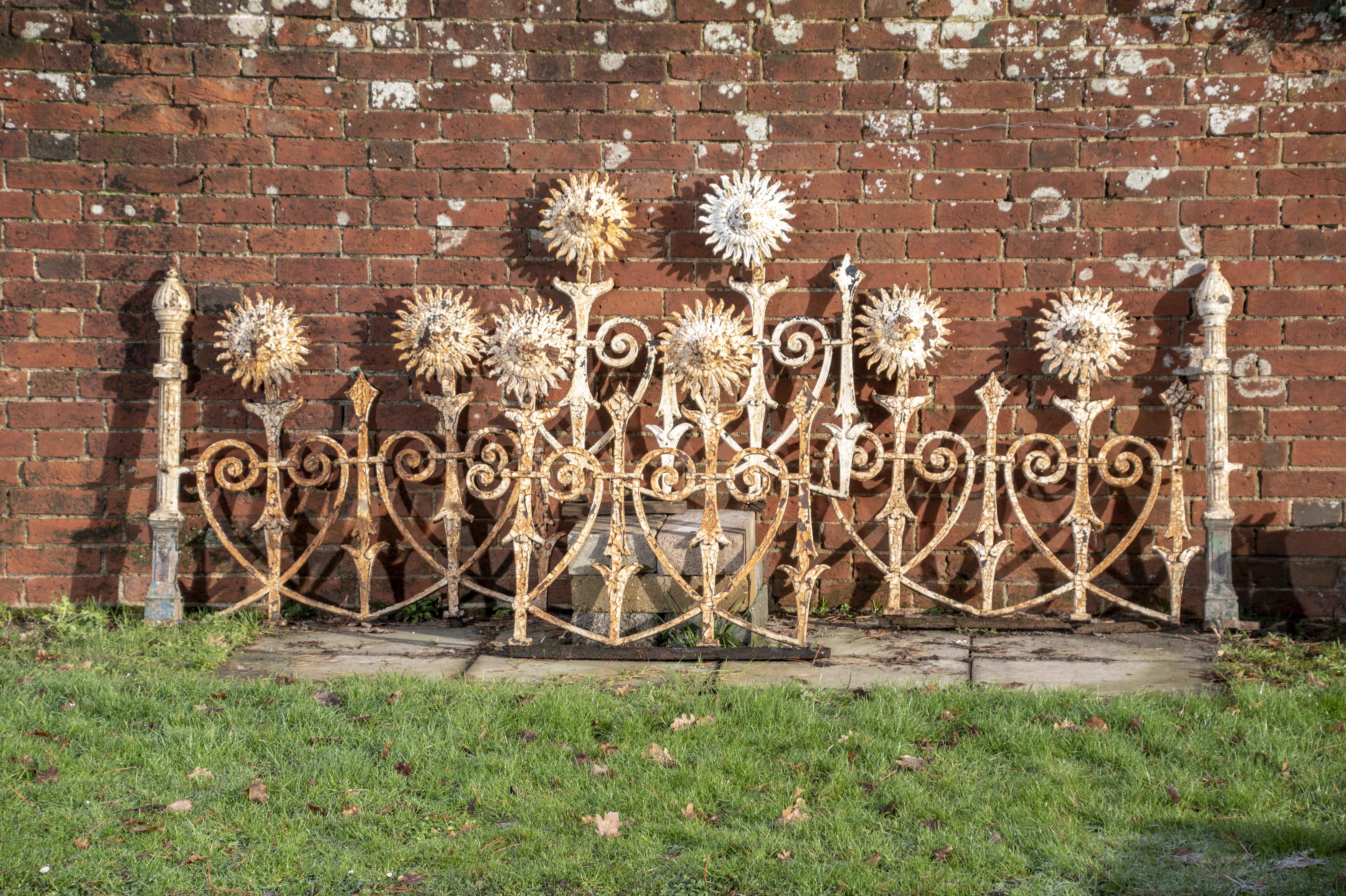 A quantity of unusual cast iron sunflower railing 2nd half 19th century 86cm high by approximately 11 metres long, together with two cast iron...