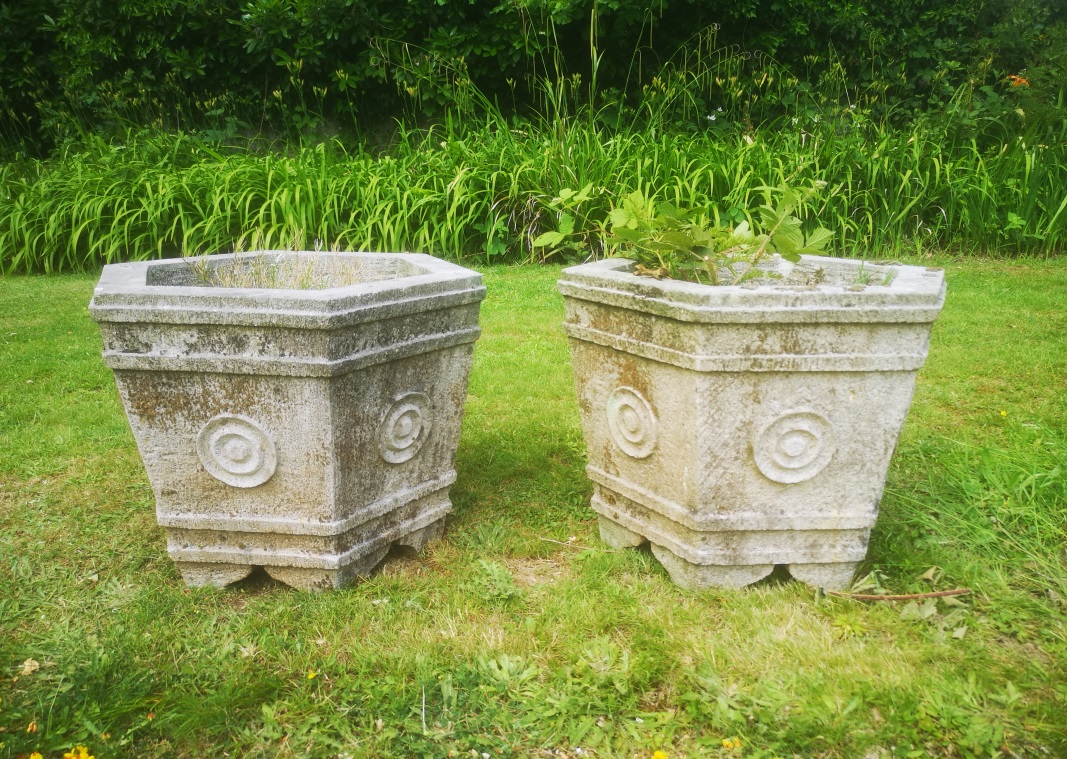 †A pair of hexagonal carved sandstone planters modern,  46cm high, 50cm wide 