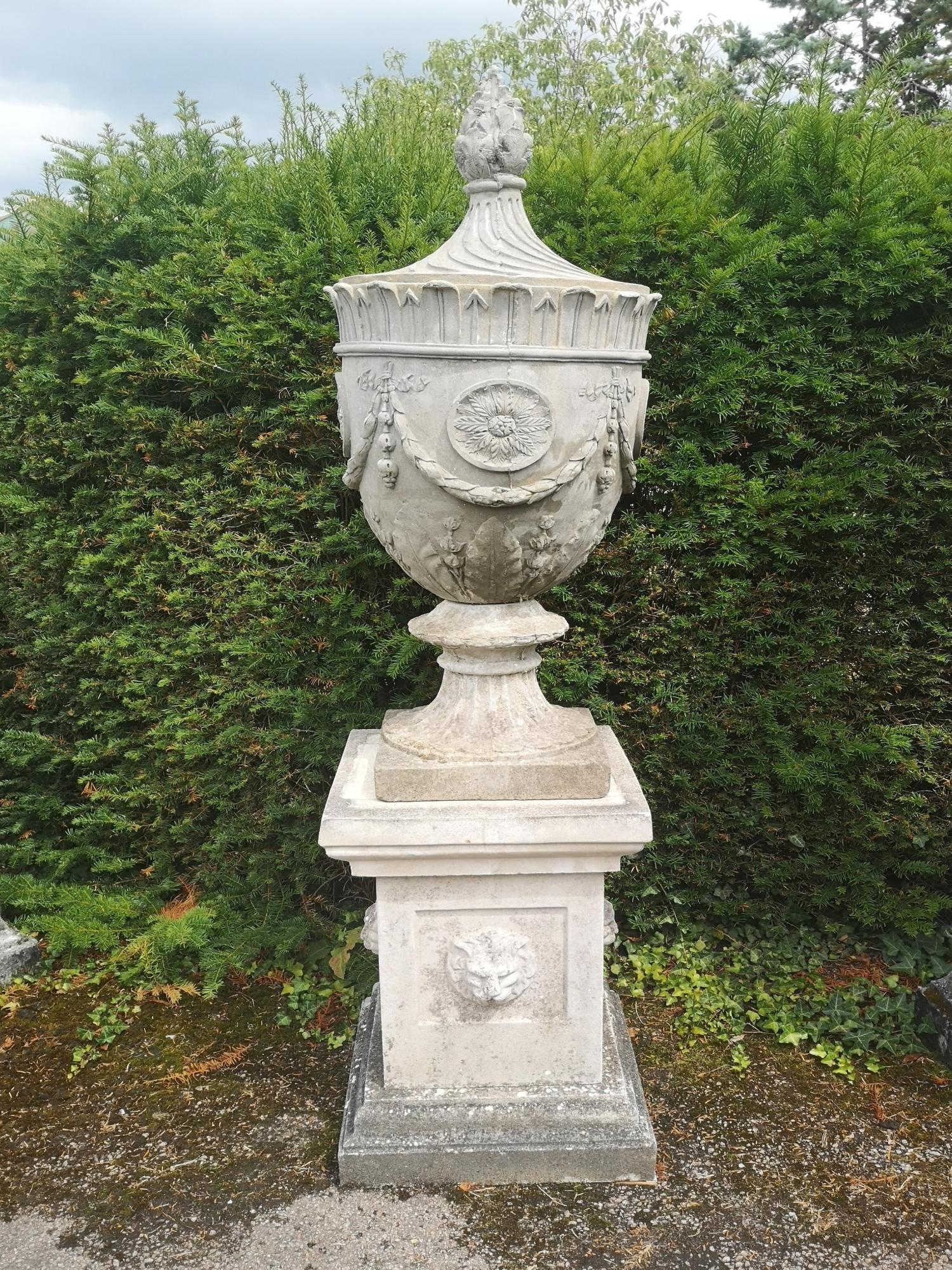 A composition stone Adam style finial on pedestal modern 195cm high overall