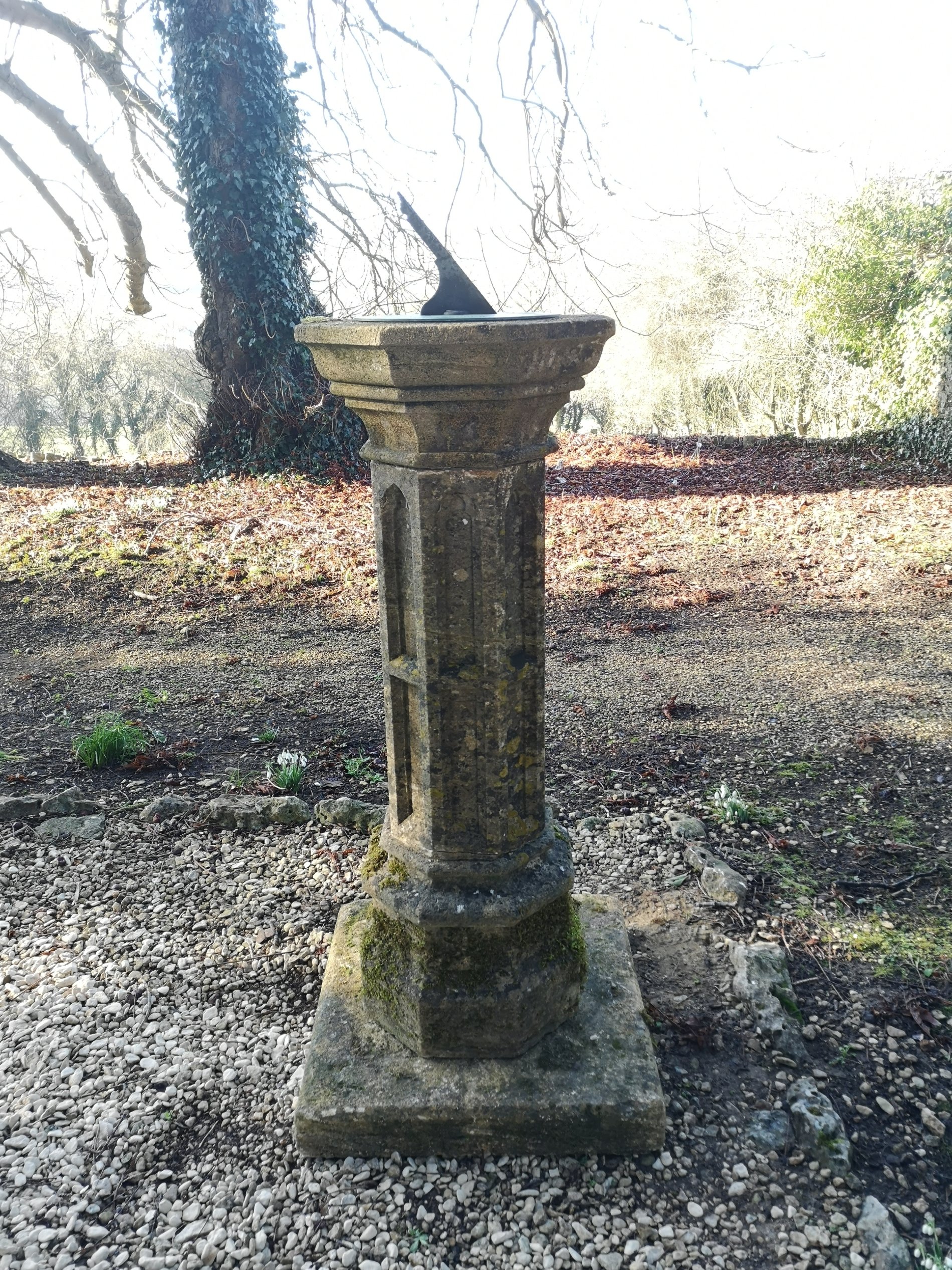 A substantial Victorian gothic carved Cotswold stone sundial