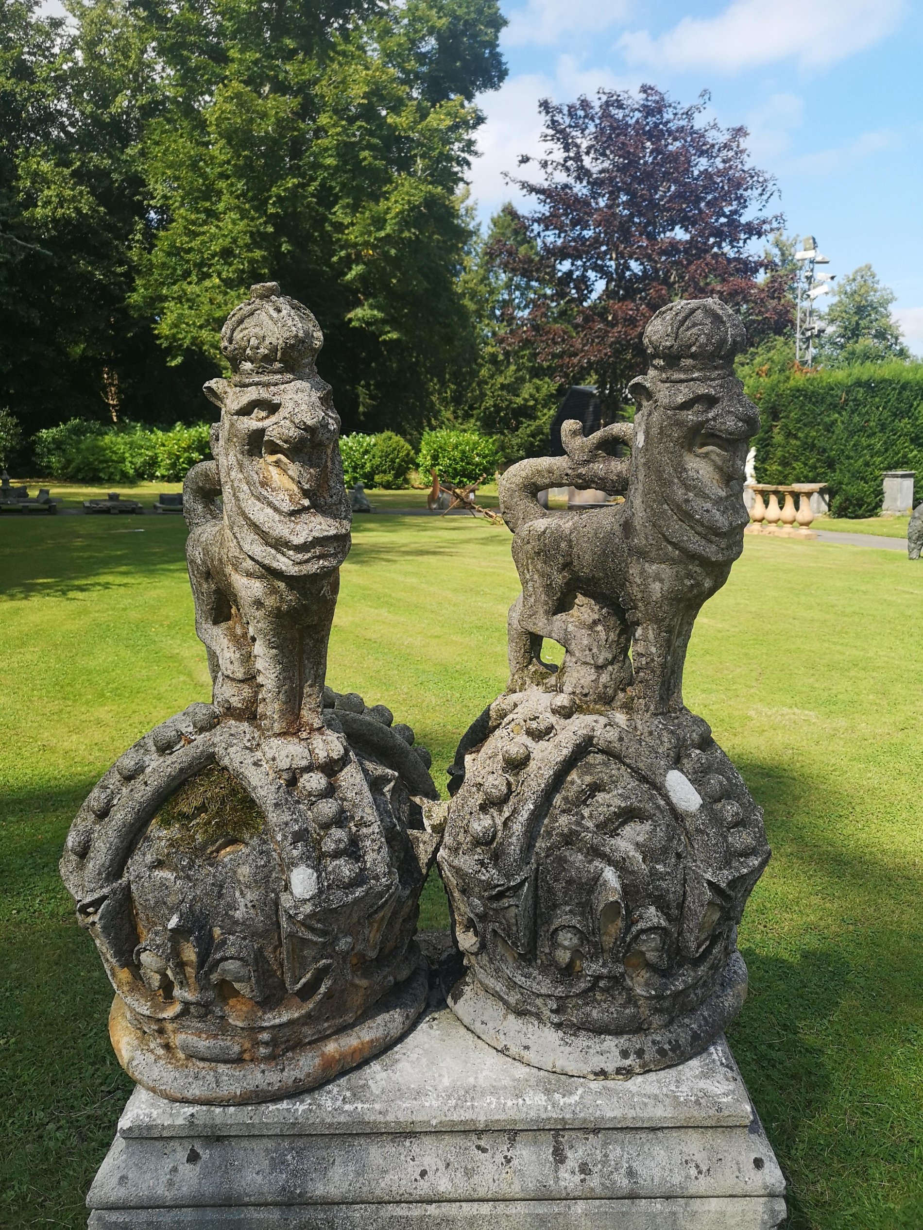 A pair of unusual composition stone armorial crowns