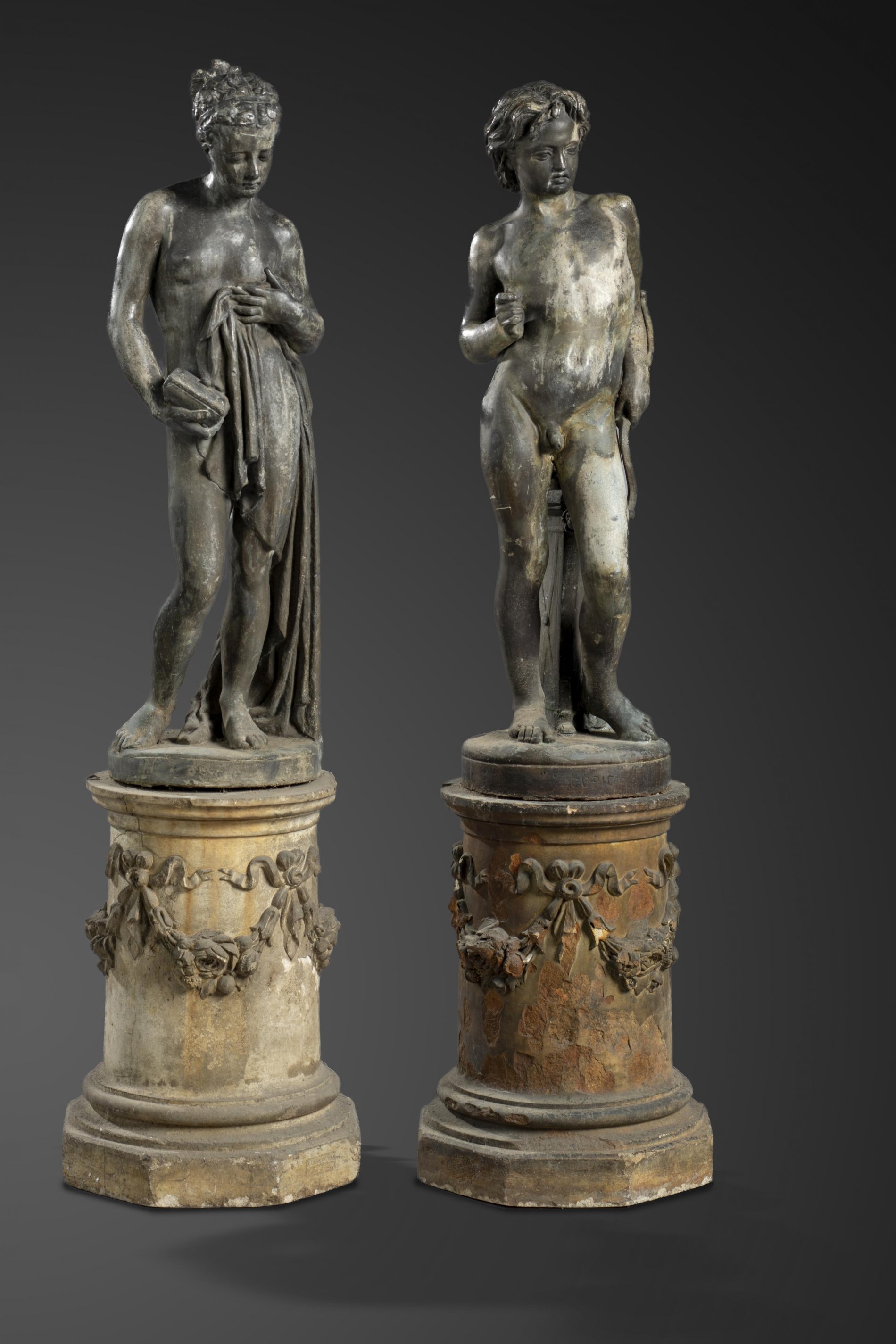 A pair of lead figures of Cupid and Psyche