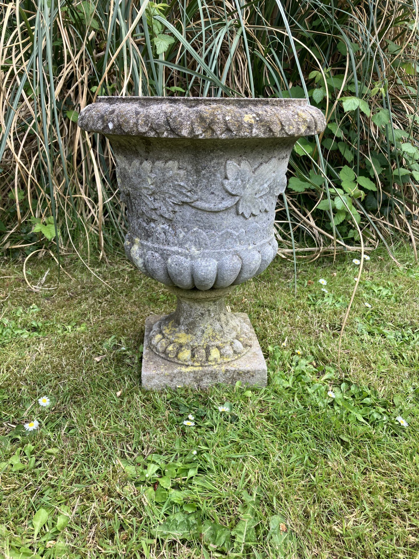 A set of six composition stone urns