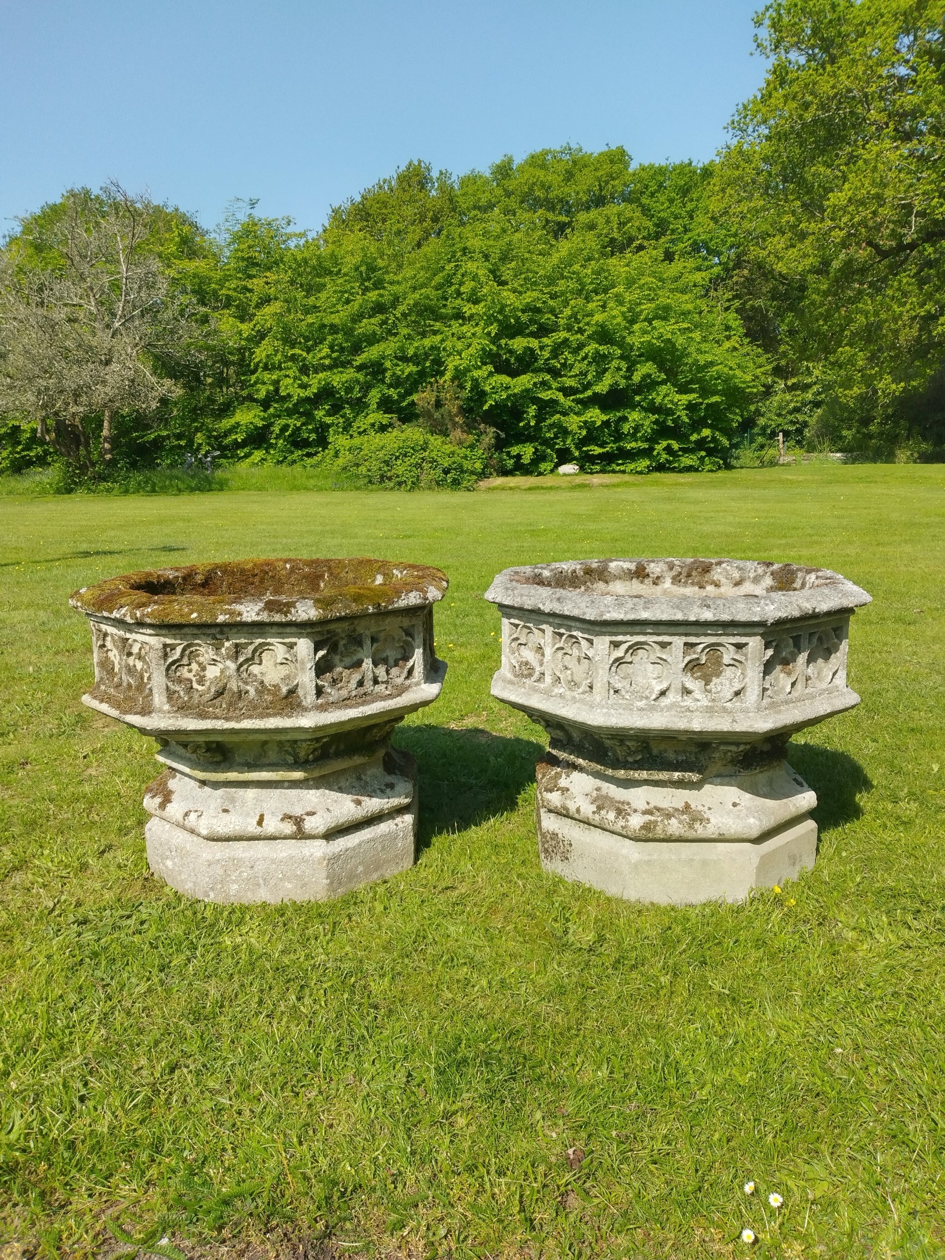 A set of four octagonal composition stone gothic planters