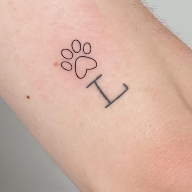 My second tattoo . They really are addicting. L stands for Leo and then the new dog paw to go with it 😀#tattoo