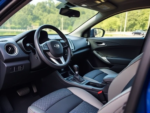 Close-up of a SsangYong Tivoli's interior, showing the dashboard and steering wheel, with a focus on user-friendly design and comfortable seating, highlighting material textures and tech details.