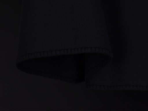 A close-up shot of a dark-colored camping tarp's fabric, highlighting its black pigment coating and showing a cool, shaded area underneath.