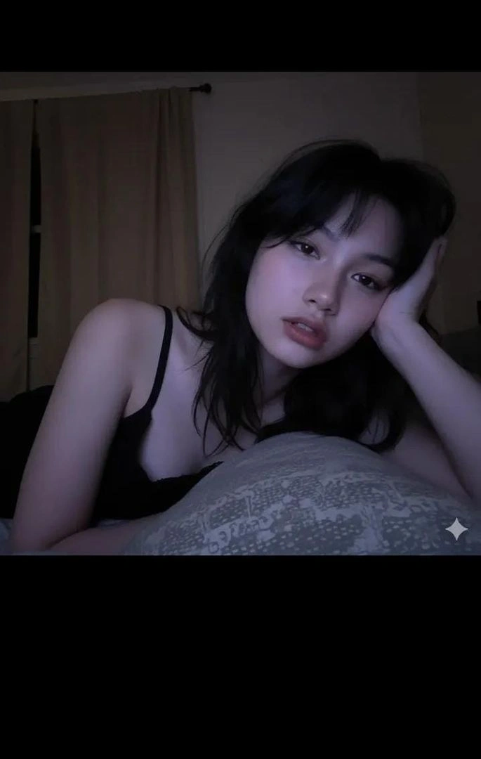 Cozy Low-Light Bedroom Selfie with Blue Glow - Example 1