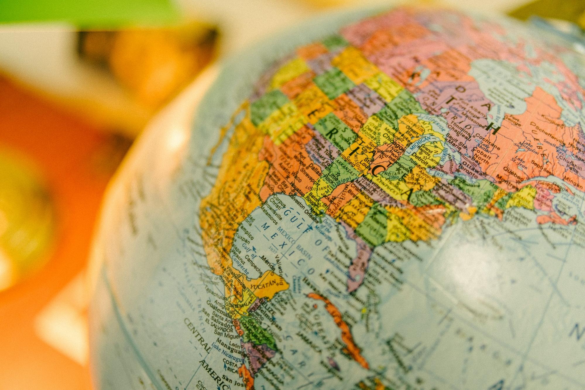 Diverse cultural representations surrounding a globe