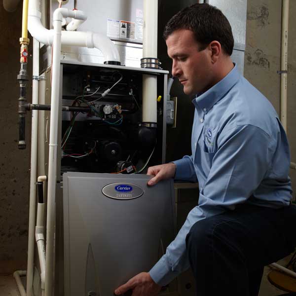 Technician repairing an HVAC unit 