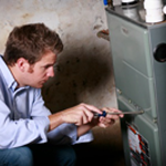 repairman working on hvac equipment