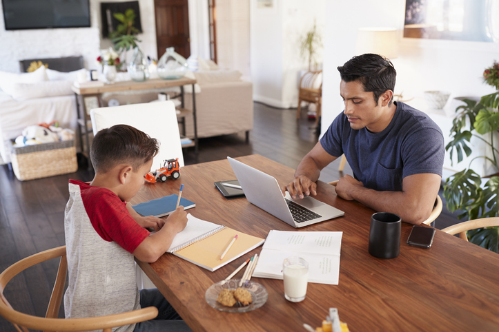 father and son working from home