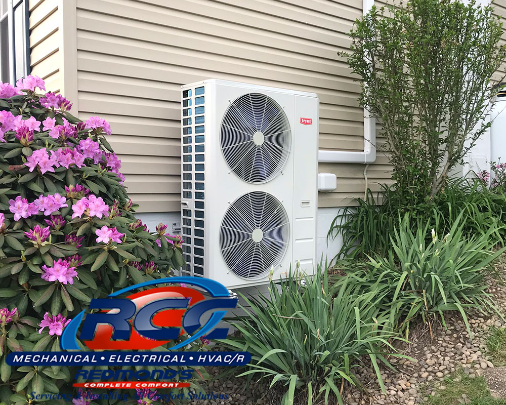 Bryant ductless heat pump outside tan house near Howard and Avis, PA