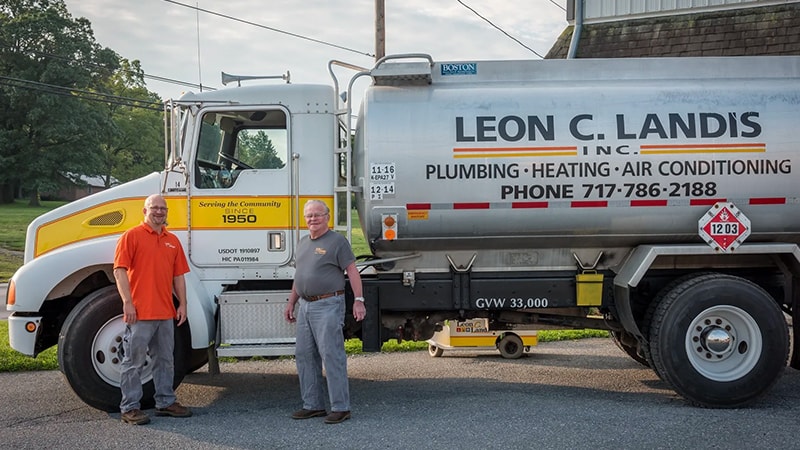 Employees of Leon C. Landis, Inc. standing in front of a company fuel delivery truck