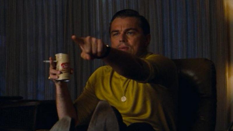 Leonardo DiCaprio as Rick Dalton from Once Upon a Time In Hollywood, pointing at something he recognized on the TV