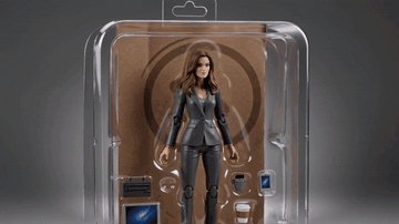 AI-generated collectible action figure in blister packaging orbiting on a shelf