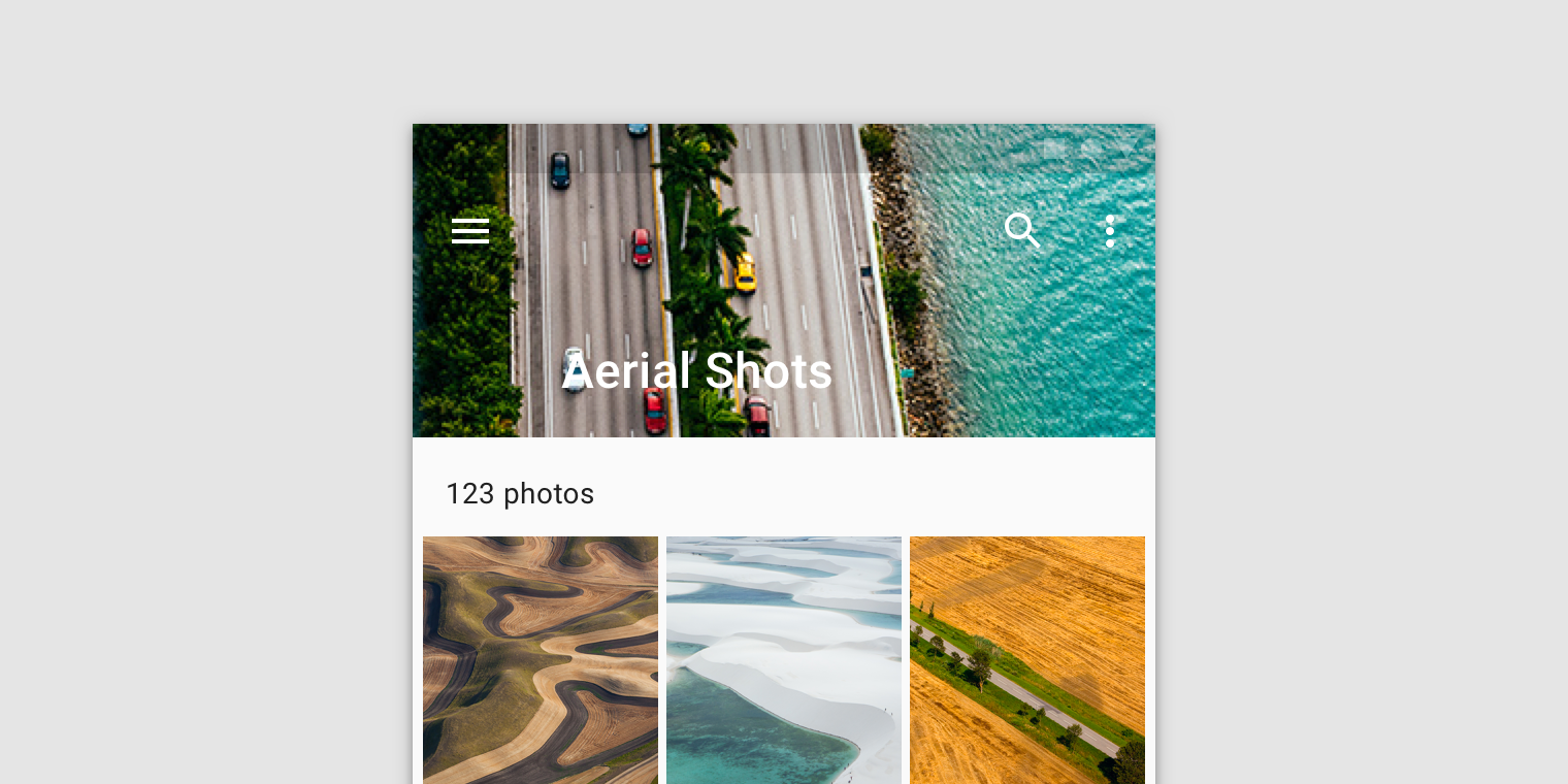 The text “Aerial Shots” is hard to read over the image underlay in a top app bar.