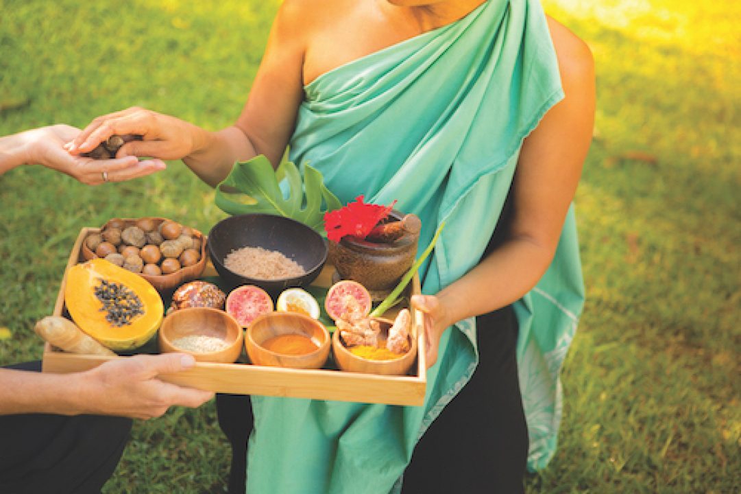 Jeana Naluai holding tray of food